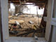 Window of destroyed home thumbnail